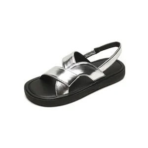 Silver metallic wide strap sandals with black platform soles and elastic back straps