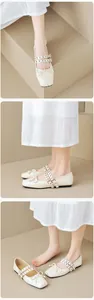 Detail of cream ballet flats with double grommet straps and a small bow detail
