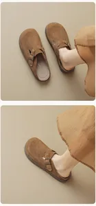 Macro shot of brown suede platform mules with adjustable metal buckle and non-slip sole
