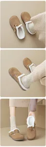 Detail view of brown suede clogs with soft faux shearling lining and metal buckle strap