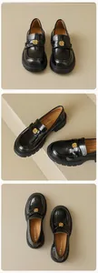 Detail of black patent leather platform loafers featuring a golden camellia floral buckle