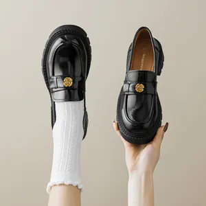 Classic black platform loafers with gold floral buckle and comfortable chunky heel
