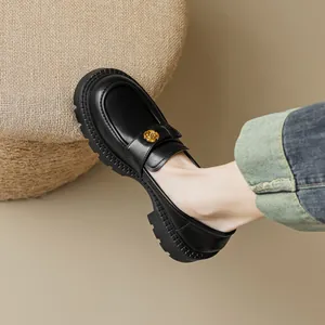 Retro black platform loafers with golden rose metal detail and thick lug sole for women
