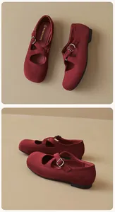 Detail of burgundy suede Mary Jane flats showing cross straps and round toe design