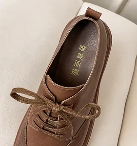 Macro detail of brown leather shoe interior with thick latex padding and stitching