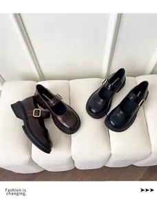 Detail of round toe Mary Jane loafers with adjustable metal buckles in brown and black