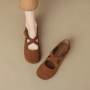 Brown suede Mary Jane ballet flats with cross straps and vintage round toe design