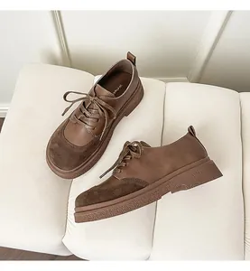 Macro view of retro brown platform loafers featuring lace-up design and mixed materials