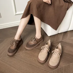 Retro platform Birkenstock style loafers in dark brown and beige with chunky soles