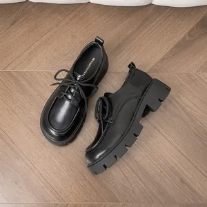 Classic black platform lace-up loafers for women with a rugged chunky lug sole