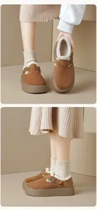 Close-up of caramel suede platform mule shoes with warm faux shearling lining and metal buckle