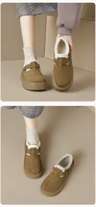 Close-up of brown suede platform Birkenstock mules with warm fleece lining and metal buckle