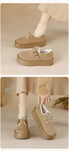 Detailed view of camel suede platform boots with plush lining and metal buckle strap