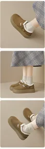 Detail view of khaki suede platform loafers with warm faux fur lining and buckle