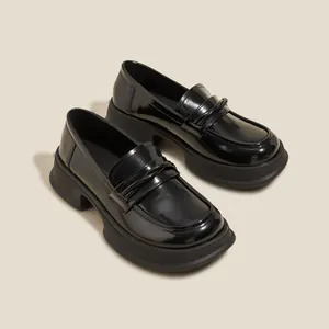 Glossy black platform loafers for women with a classic bow detail and chunky sole