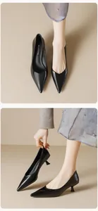 Close-up of black pointed-toe kitten heels with glossy finish and elegant side profile