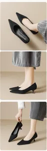 Detailed views of black pointed-toe kitten heel pumps with soft suede-like finish