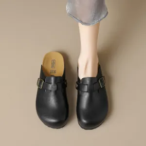 Classic black leather platform mule with adjustable buckle and soft brown footbed