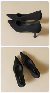 Close-up of black suede pointed-toe pumps featuring elegant kitten heels and a matte finish