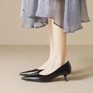Glossy black pointed-toe kitten heels for women with a sleek patent leather finish