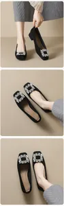 Detail of square toe black suede shoes with sparkling rhinestone buckles for women