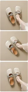Detail view of square-toe flat mules featuring beige leather and floral fabric bow accents