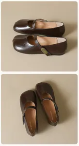 Detailed macro view of the dark brown Mary Jane flat with a vintage gold metal buckle