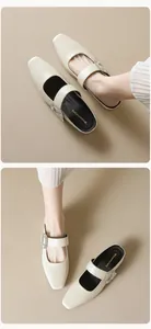 Detailed view of square-toe mule slippers with sparkling rhinestone buckle on creamy beige leather