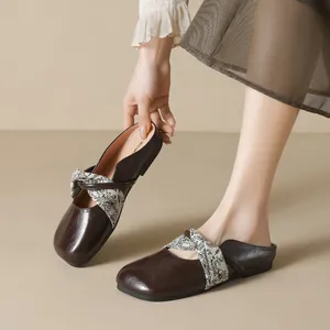 Square toe flat brown mules featuring floral printed fabric cross straps for women