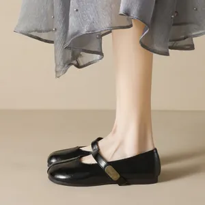 Classic black round toe Mary Jane flats with polished finish and fashion metal buckle