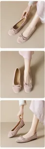 Detailed views of light pink suede ballet flats with a delicate bow and round toe