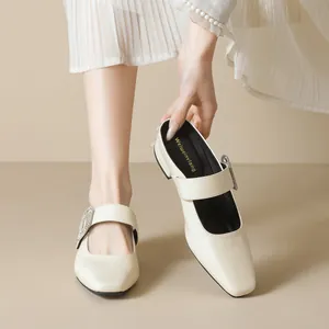 French style square toe Mary Jane mules in beige with sparkling rhinestone buckles