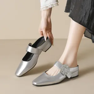 Silver square-toe rhinestone mule featuring metallic finish and low block heel