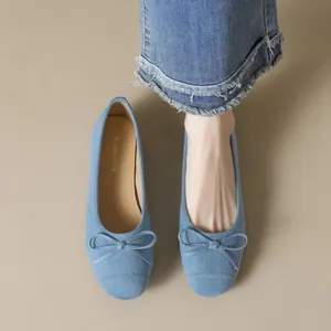 Elegant light blue suede ballet flats with bow detail and soft comfortable soles