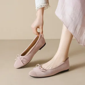 Pink suede flat ballet shoes with bow detail and soft sole for women's casual wear