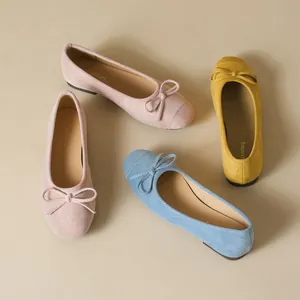 French ballet flats for women with bow ties in pink, blue, and yellow suede finish