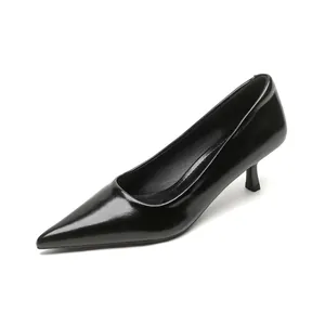 Elegant black pointed toe pumps in glossy patent leather with slim high heels