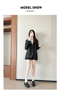Classic black chunky loafers styled with a preppy blazer and pleated skirt