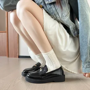 Women's black patent leather platform loafers with metal buckle and chunky thick sole