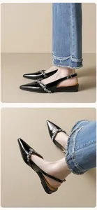Λεπτομέρεια από μαύρα λουστρίνι μυτερά slingbacks με λουράκι από αστραφτερά στρας