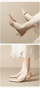 Detail of beige slingback heels with pointed toe and elegant kitten heel design