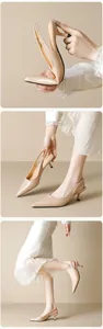 Detailed view of flexible beige kitten heel slingback shoes with a pointed toe design