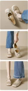Detailed view of champagne satin ballet flats with bow and double metal eyelet straps