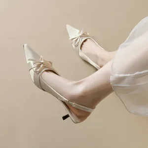 Elegant pointed-toe kitten heel slingback shoes with bow in ivory satin finish