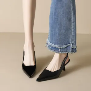Elegant black pointed-toe slingback heels with slim stiletto heel for modern women