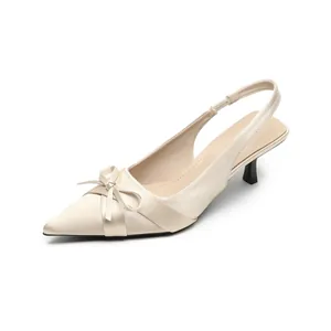 Elegant pointed toe slingback heels with satin bow detail and slim stiletto heel