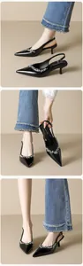 Detailed view of black pointed-toe slingback heels with sparkling rhinestone decoration