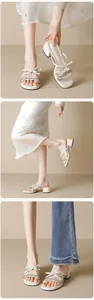 Detail view of cream fairy-style mules featuring rhinestone straps and bow decoration