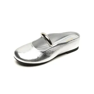 Silver metallic leather mule shoes with round toe and strap in a minimalist French style