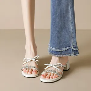 White fairy style high heel sandals with rhinestone bow and stable block heels